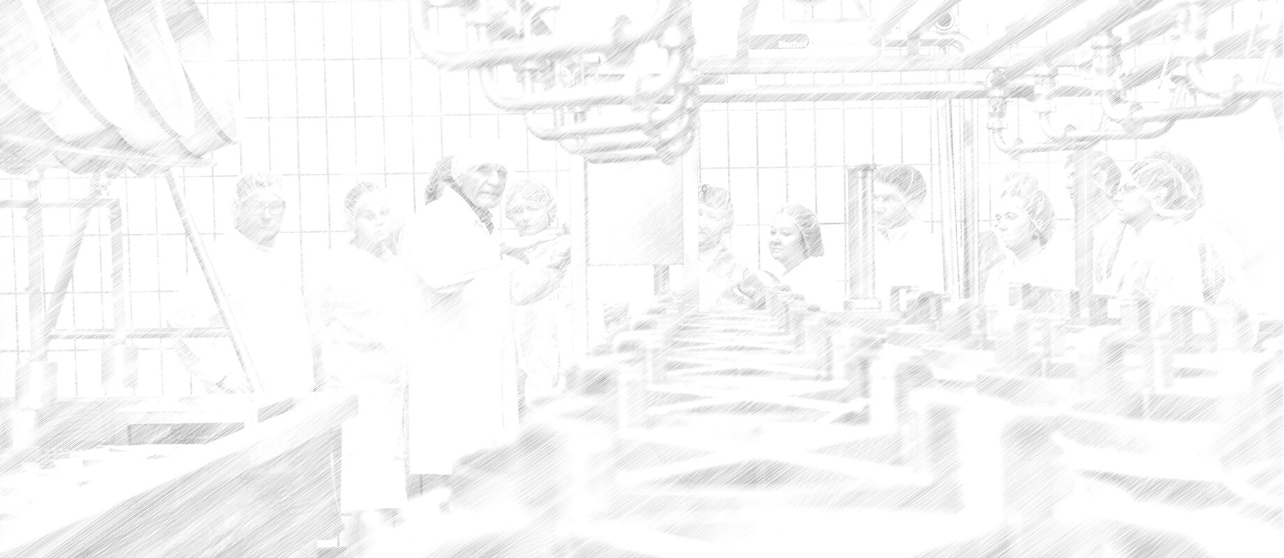 Das Bild zeigt eine Gruppe von Personen in einem industriellen oder laborähnlichen Umfeld, wahrscheinlich bei der Arbeit oder Schulung.